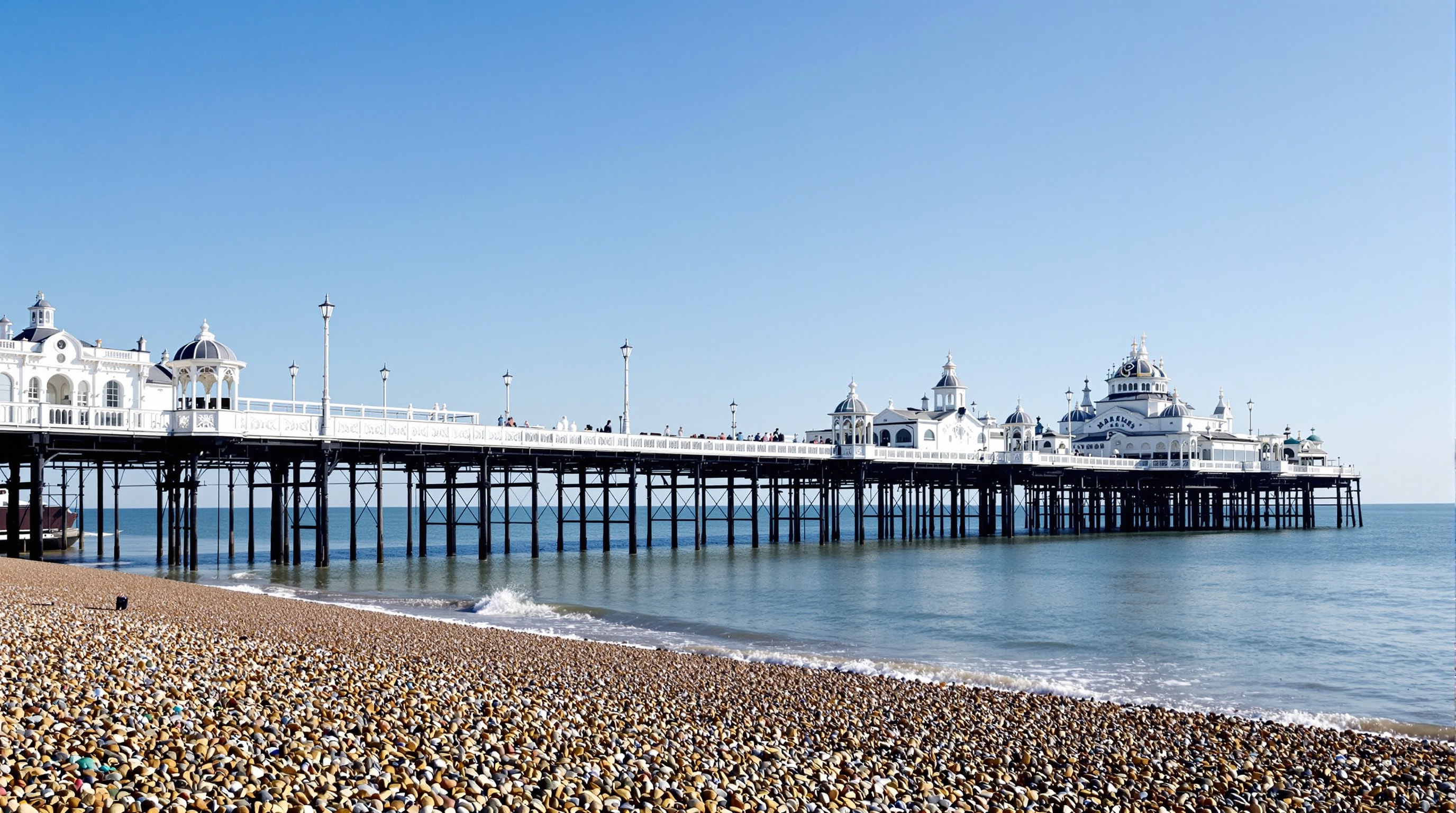 A Victorian seaside pier reaching out over the sea at Eastbourne